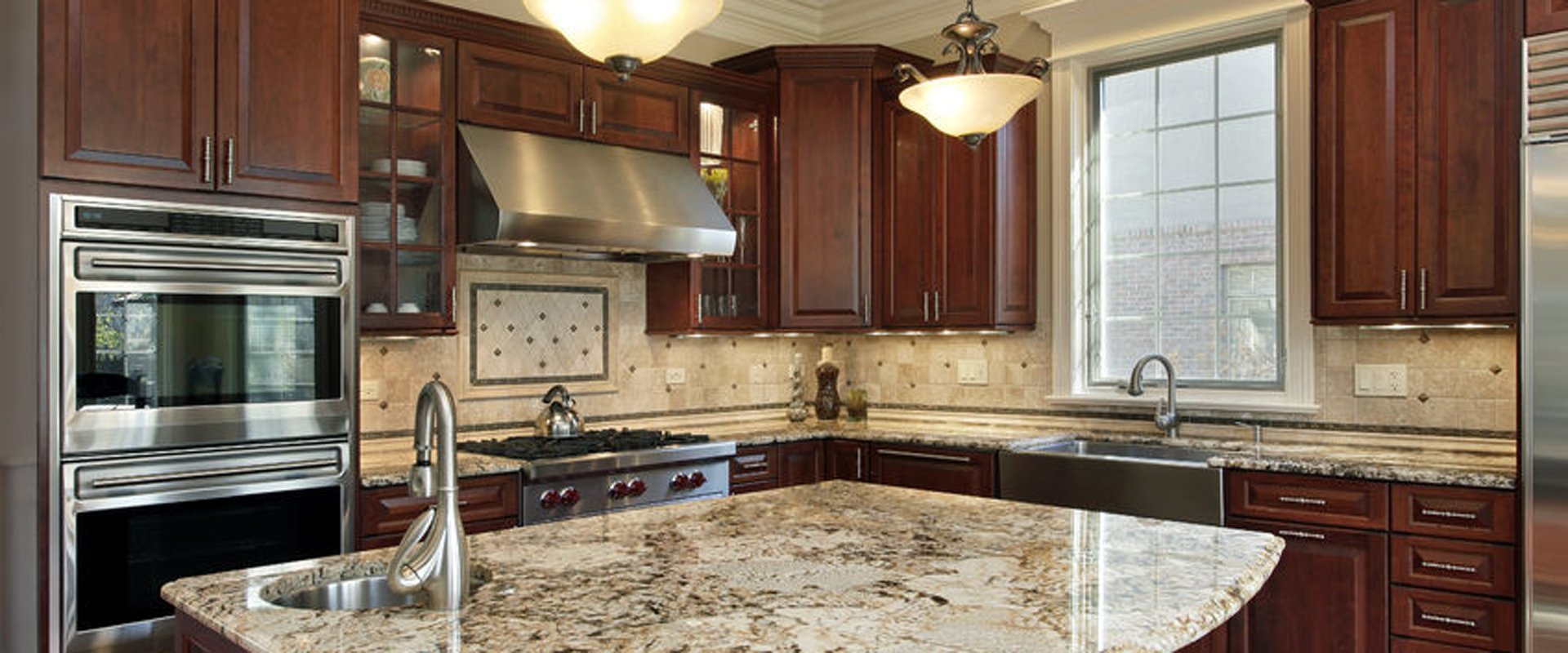 50031171 - kitchen with granite island and cherry wood cabinetry